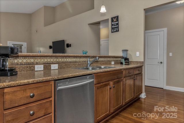 32 White Fox Dr, Fletcher, NC 28732 - kitchen featuring stainless steel dishwasher, a sink, dark wood-style flooring, brown cabinets, and baseboards