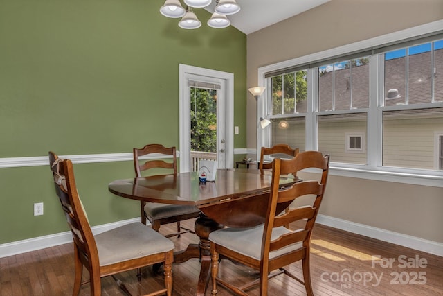 32 White Fox Dr, Fletcher, NC 28732 - dining room with wood-type flooring, a chandelier, and baseboards