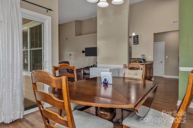 32 White Fox Dr, Fletcher, NC 28732 - dining area with wood finished floors, baseboards, and a high ceiling