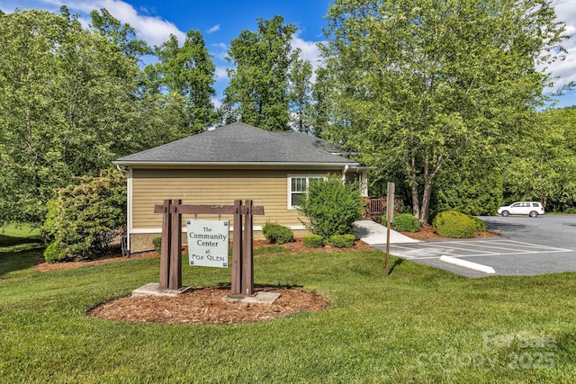 32 White Fox Dr, Fletcher, NC 28732 - exterior view of parking, a downspout, and roof with shingles