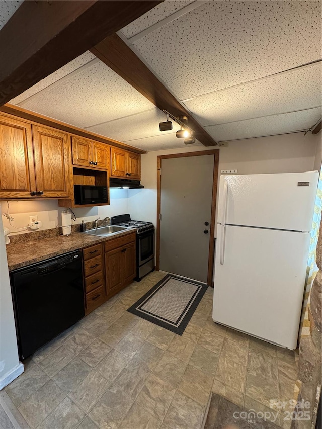 58 Creekside Dr Unit C, Banner Elk, NC 28604 - kitchen featuring black appliances, dark countertops, brown cabinetry, a sink, and under cabinet range hood