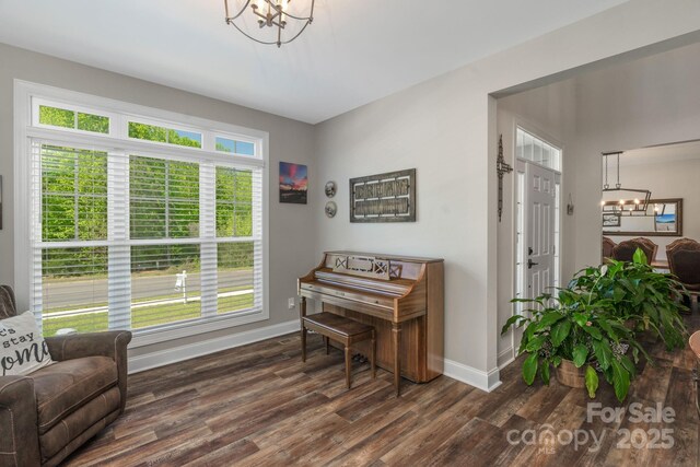 3011 Waxhaw Crossing Dr, Waxhaw, NC 28173 - living area featuring a chandelier, baseboards, and dark wood-type flooring