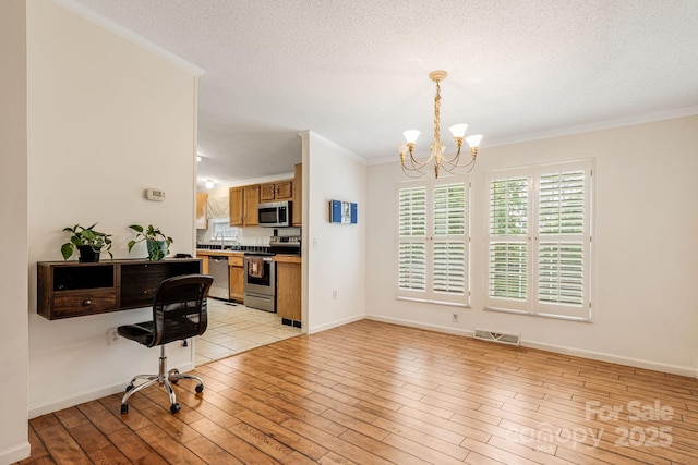 553 New Hope Rd, Rutherfordton, NC 28139 - home office featuring crown molding, a chandelier, light wood finished floors, baseboards, and a textured ceiling