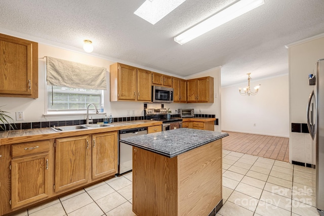 553 New Hope Rd, Rutherfordton, NC 28139 - kitchen featuring appliances with stainless steel finishes, a sink, crown molding, light tile patterned flooring, and a textured ceiling