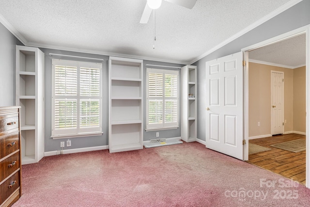553 New Hope Rd, Rutherfordton, NC 28139 - unfurnished bedroom with a textured ceiling, ornamental molding, baseboards, carpet, and a ceiling fan