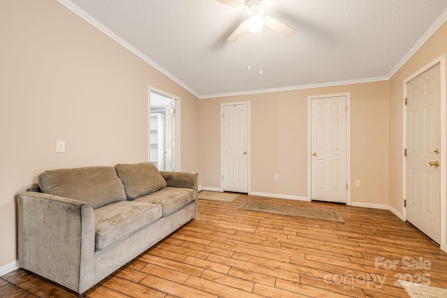 553 New Hope Rd, Rutherfordton, NC 28139 - living room with ornamental molding, ceiling fan, light wood-type flooring, baseboards, and a textured ceiling