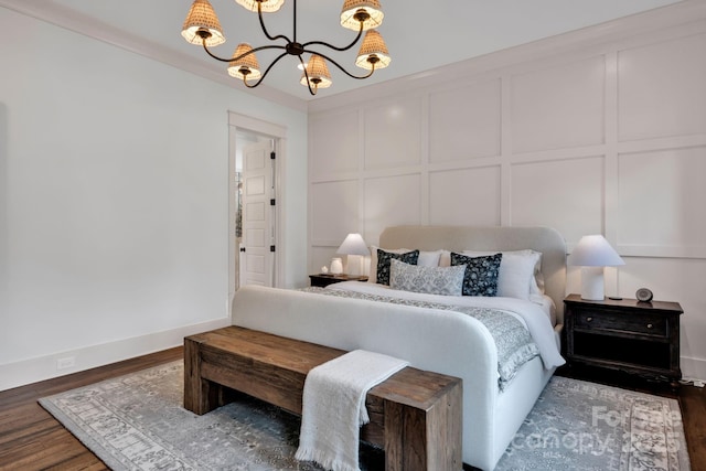 14105 Ryker Way, Davidson, NC 28036 - bedroom with a decorative wall, wood finished floors, and a chandelier