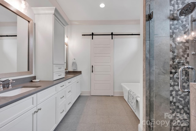 14105 Ryker Way, Davidson, NC 28036 - full bath with double vanity, a soaking tub, a stall shower, and recessed lighting