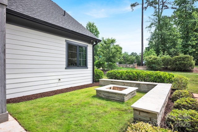 14105 Ryker Way, Davidson, NC 28036 - view of green lawn with an outdoor fire pit