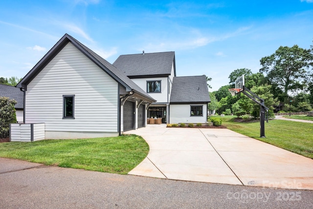 14105 Ryker Way, Davidson, NC 28036 - view of front facade with concrete driveway, a front lawn, an attached garage, and roof with shingles