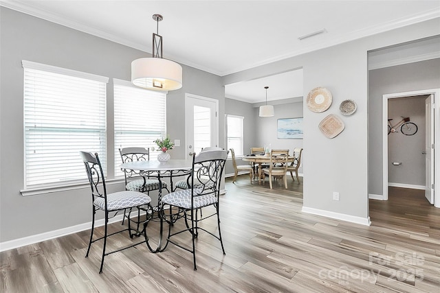 2840 Hopeton Ct, Monroe, NC 28110 - dining area with wood finished floors, ornamental molding, and baseboards