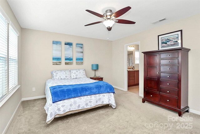 2840 Hopeton Ct, Monroe, NC 28110 - bedroom featuring light carpet, baseboards, ensuite bathroom, and a ceiling fan