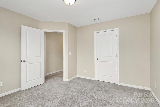 2840 Hopeton Ct, Monroe, NC 28110 - unfurnished bedroom featuring carpet and baseboards