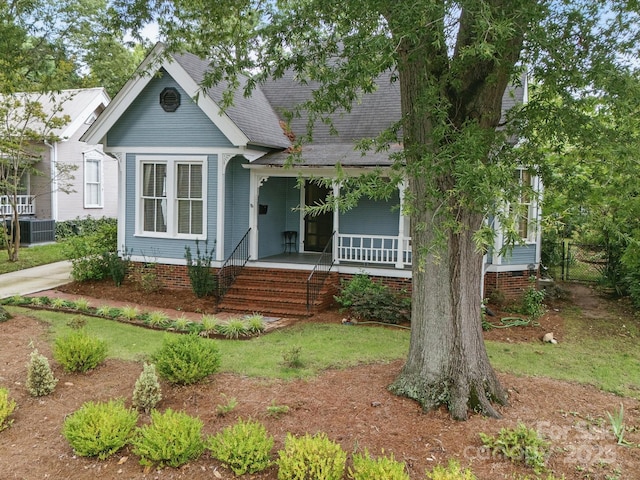 308 W Monroe St, Salisbury, NC 28144 - view of front of property with covered porch, a shingled roof, and central air condition unit