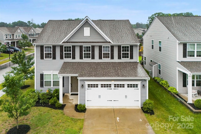 1022 Hinson Forest Rd, Monroe, NC 28110 - traditional-style home with roof with shingles, concrete driveway, a front yard, and an attached garage