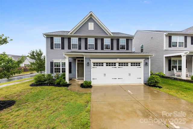 1022 Hinson Forest Rd, Monroe, NC 28110 - traditional-style home with a front lawn, concrete driveway, and a garage