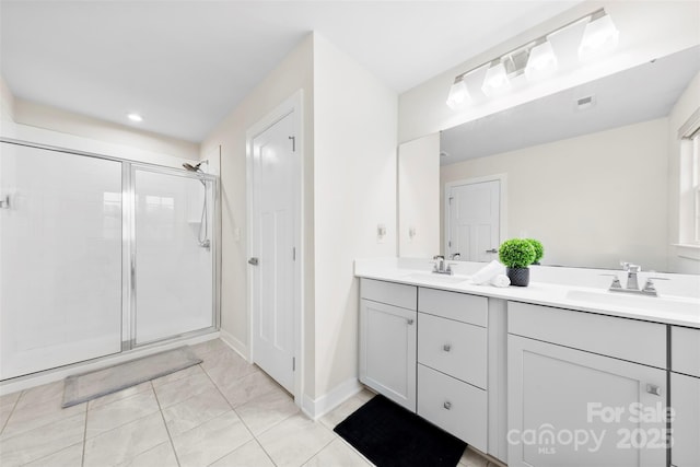 1022 Hinson Forest Rd, Monroe, NC 28110 - bathroom with double vanity, a stall shower, recessed lighting, and tile patterned floors