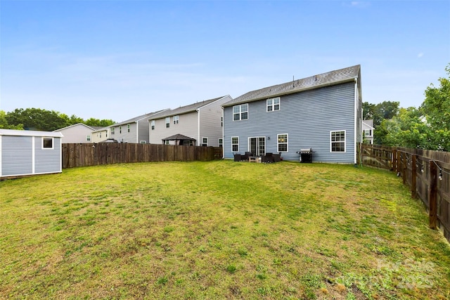1022 Hinson Forest Rd, Monroe, NC 28110 - rear view of house featuring a fenced backyard and a storage shed