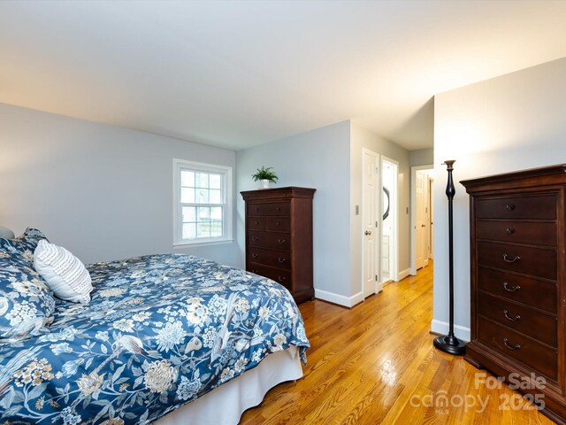 6941 Queensberry Dr, Charlotte, NC 28226 - bedroom featuring light wood finished floors and baseboards