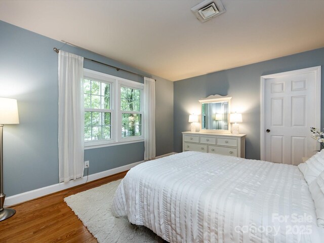 6941 Queensberry Dr, Charlotte, NC 28226 - bedroom featuring wood finished floors and baseboards