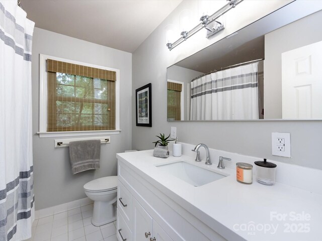 6941 Queensberry Dr, Charlotte, NC 28226 - bathroom featuring vanity, toilet, tile patterned flooring, and baseboards