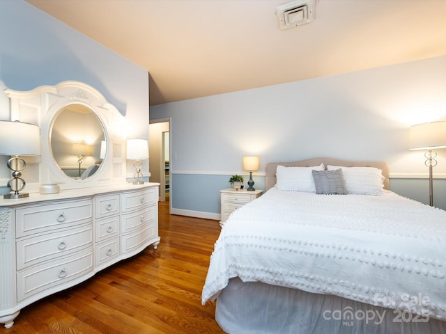 6941 Queensberry Dr, Charlotte, NC 28226 - bedroom with dark wood finished floors and baseboards