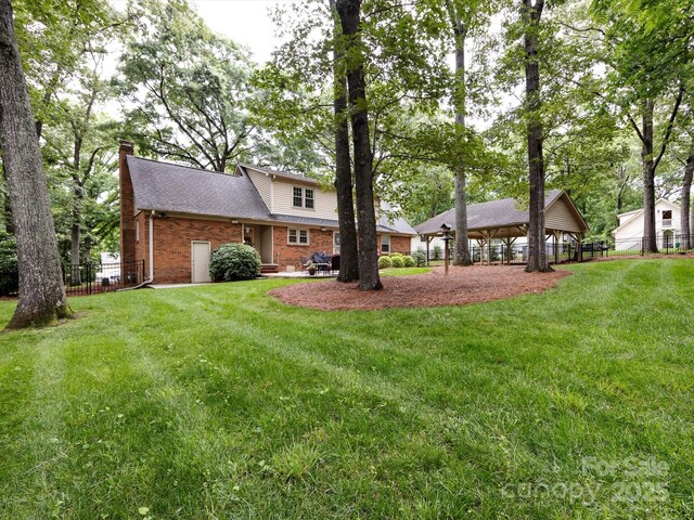 6941 Queensberry Dr, Charlotte, NC 28226 - rear view of property featuring brick siding, a chimney, and a shingled roof