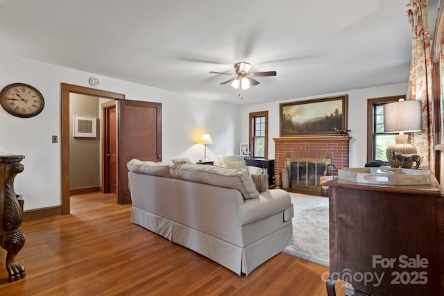 495 Fairview Rd, Asheville, NC 28803 - living area featuring ceiling fan, a fireplace, healthy amount of natural light, and baseboards