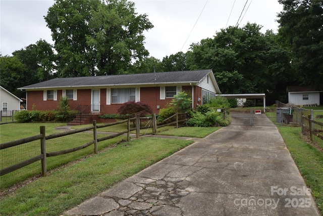 908 Ravendale Dr, Charlotte, NC 28216 - ranch-style house with brick siding and driveway