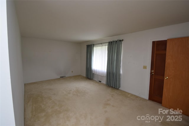 908 Ravendale Dr, Charlotte, NC 28216 - unfurnished room with carpet flooring