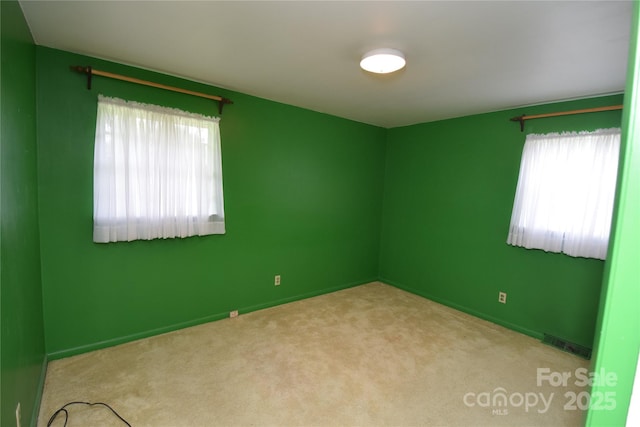 908 Ravendale Dr, Charlotte, NC 28216 - carpeted spare room with plenty of natural light and baseboards