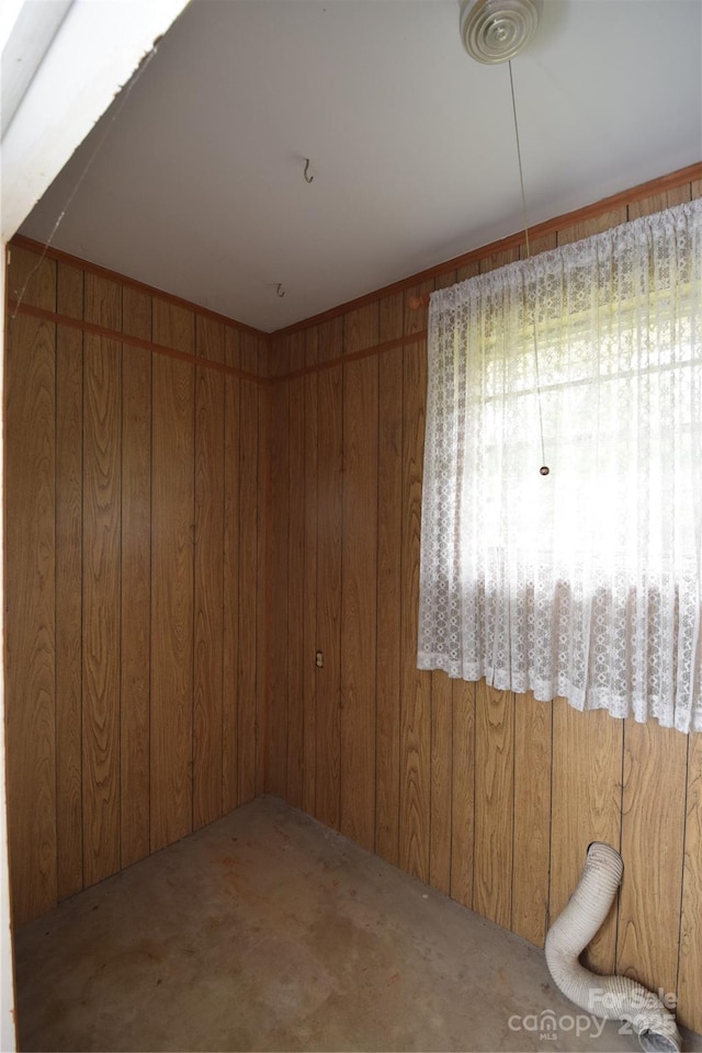 908 Ravendale Dr, Charlotte, NC 28216 - empty room with wood walls and carpet floors