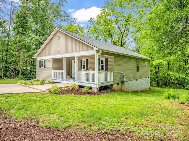125 Woodland Cir, Rutherfordton, NC 28139 - view of front facade featuring a porch, roof with shingles, a front yard, and crawl space