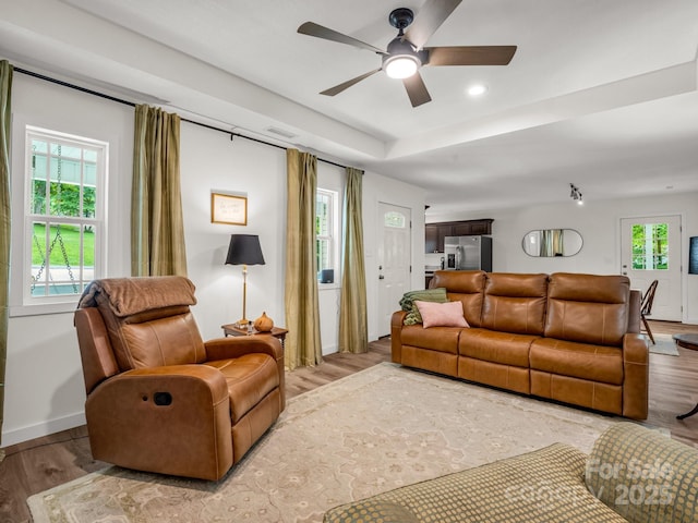 125 Woodland Cir, Rutherfordton, NC 28139 - living area featuring ceiling fan, wood finished floors, baseboards, recessed lighting, and a tray ceiling