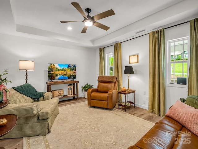 125 Woodland Cir, Rutherfordton, NC 28139 - living room with a tray ceiling, light wood-type flooring, ceiling fan, baseboards, and recessed lighting