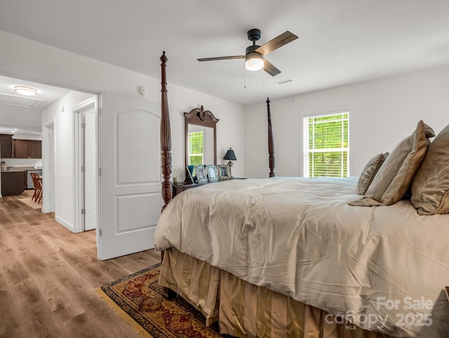 125 Woodland Cir, Rutherfordton, NC 28139 - bedroom with light wood-style floors and a ceiling fan