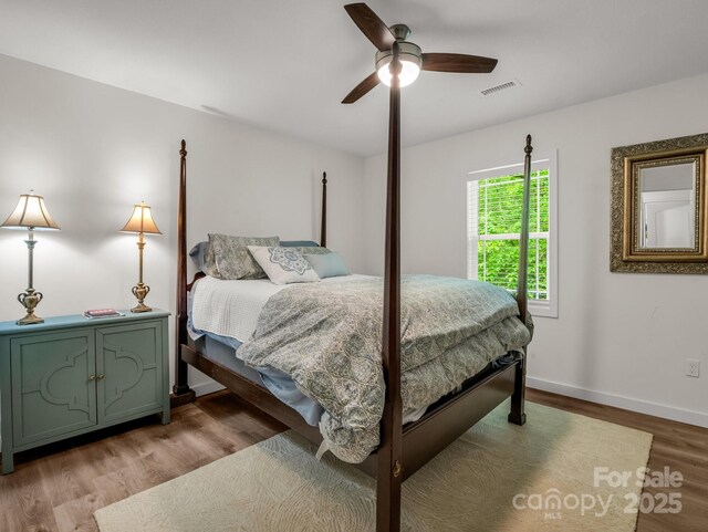 125 Woodland Cir, Rutherfordton, NC 28139 - bedroom with wood finished floors, baseboards, and ceiling fan
