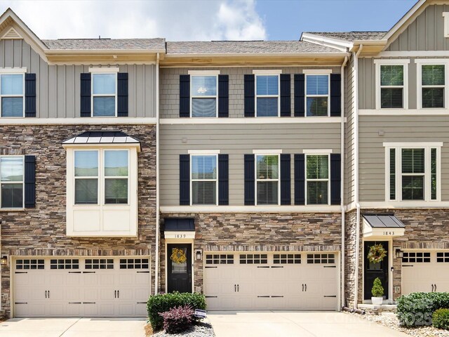 1839 Shumard Ln, Charlotte, NC 28205 - multi unit property featuring board and batten siding, stone siding, concrete driveway, and a garage