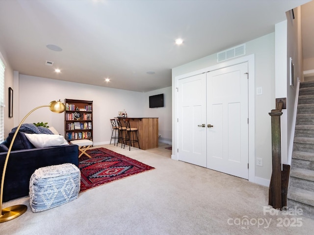 1839 Shumard Ln, Charlotte, NC 28205 - carpeted living room featuring stairway and recessed lighting