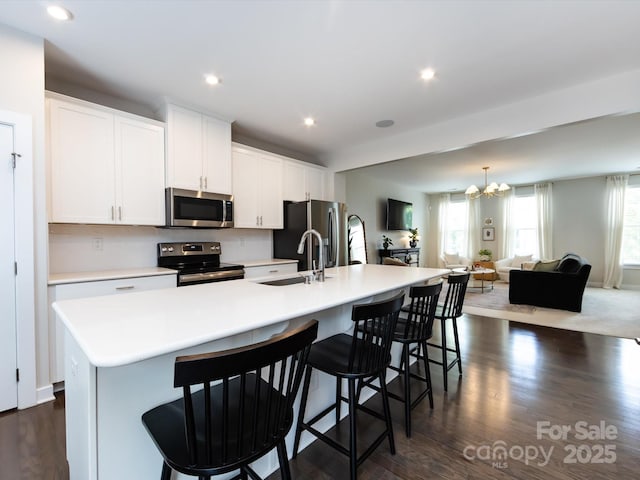 1839 Shumard Ln, Charlotte, NC 28205 - kitchen featuring stainless steel appliances, a spacious island, healthy amount of natural light, a chandelier, and recessed lighting