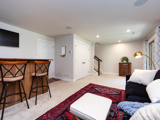 1839 Shumard Ln, Charlotte, NC 28205 - living room featuring stairway, light colored carpet, and recessed lighting