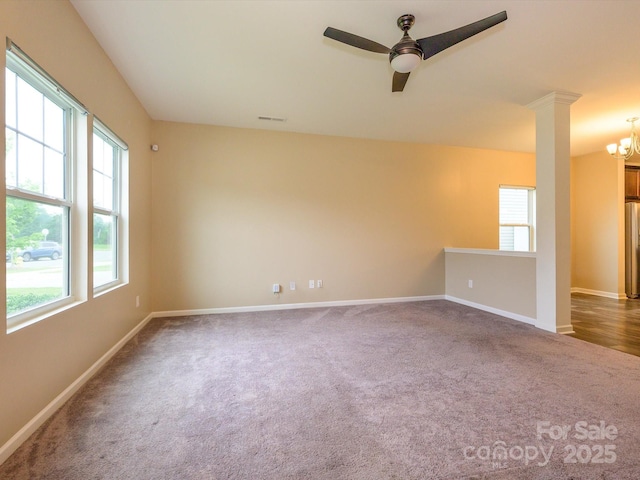 13022 Hill Pine Rd, Midland, NC 28107 - spare room with carpet flooring, plenty of natural light, and a chandelier