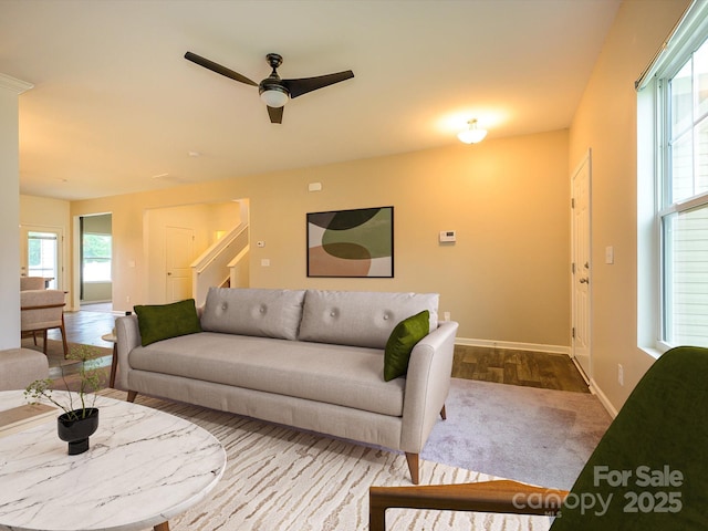 13022 Hill Pine Rd, Midland, NC 28107 - living room featuring baseboards, stairs, a ceiling fan, and carpet