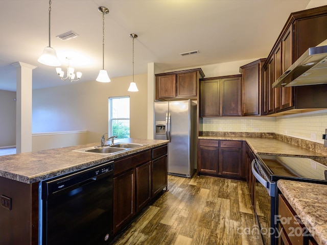 13022 Hill Pine Rd, Midland, NC 28107 - kitchen with stainless steel appliances, a sink, wall chimney exhaust hood, dark wood finished floors, and an island with sink