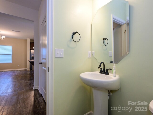 13022 Hill Pine Rd, Midland, NC 28107 - half bath featuring wood finished floors and baseboards