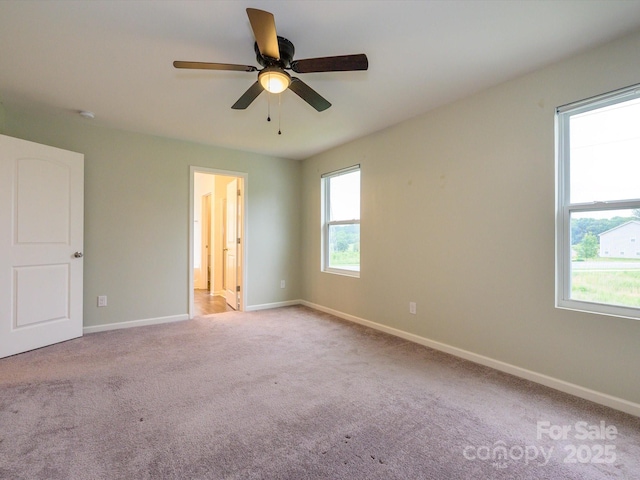 13022 Hill Pine Rd, Midland, NC 28107 - unfurnished bedroom featuring carpet floors, baseboards, connected bathroom, and a ceiling fan