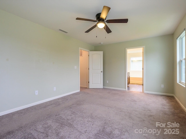 13022 Hill Pine Rd, Midland, NC 28107 - unfurnished bedroom with multiple windows, baseboards, carpet flooring, and ensuite bath