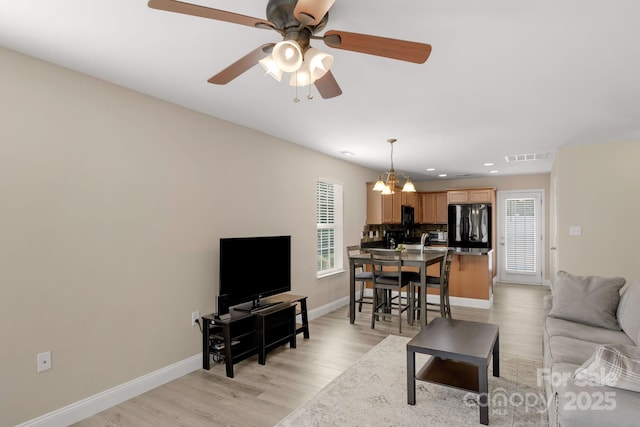 1907 Sandal Brook Rd, Fort Mill, SC 29707 - living area featuring a ceiling fan, baseboards, recessed lighting, light wood-style floors, and a chandelier