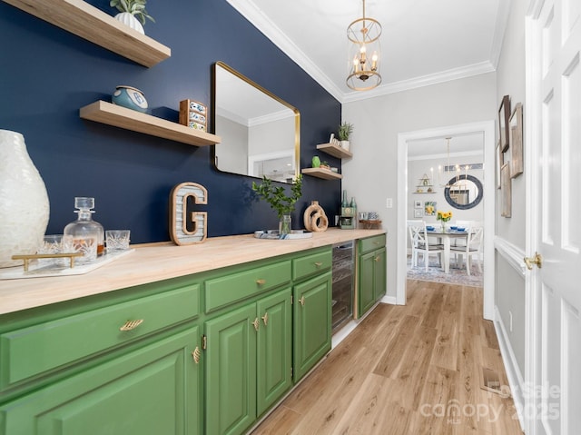 1115 Maremont Ct, Matthews, NC 28104 - bar featuring beverage cooler, a chandelier, crown molding, light wood finished floors, and hanging light fixtures
