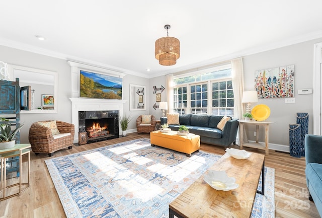 1115 Maremont Ct, Matthews, NC 28104 - living room with ornamental molding, light wood finished floors, a fireplace, baseboards, and recessed lighting